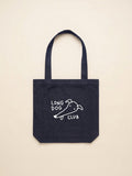 Denim tote bag with 'Long Dog Club' text and greyhound drawing on a beige background