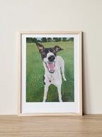 Portrait of Georgia the Greyhound, as painted by Elliott Fox for the Saint Grey art exhibition about greyhound advocacy. Georgia is smiling in a wooden frame with a grassy field behind her.