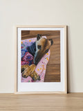 A framed art print of Miss Poppy the Greyhound, cuddled into a pink sofa. Textured painting by Elliott Fox featured as part of the Saint Grey art exhibition for greyhound advocacy. 
