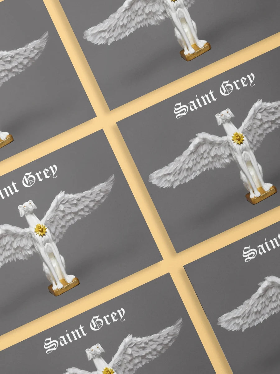 A pack of official Saint Grey exhibition postcards by Elliott Fox. The artwork is grey and features a greyhound statue with wings and a gold heart.