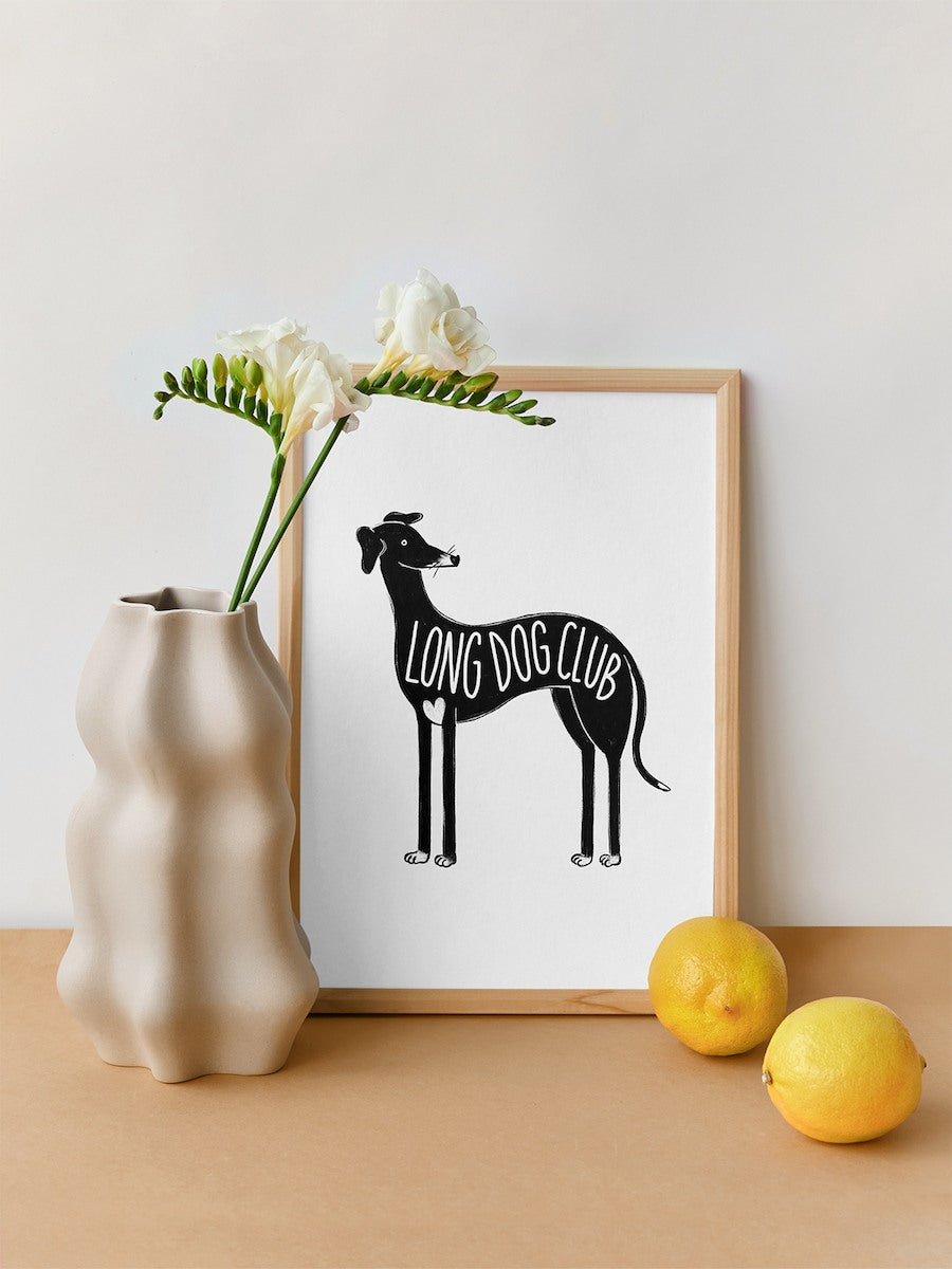 A4 dog print sitting framed on a table, ideal for people who love wall art for whippets and italian greyhounds