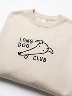 Cream sweater with embroidered 'Long Dog Club' graphic of a sighthound, on a white background