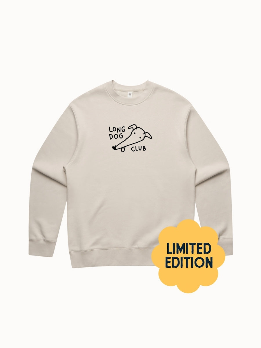Beige sweatshirt with 'Long Dog Club' text and logo on a white background, featuring a 'Limited Edition' label.